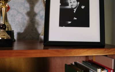 Bookshelf with a photo of a loved one.