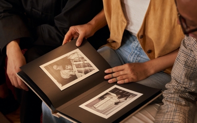 Family looking at photo book.