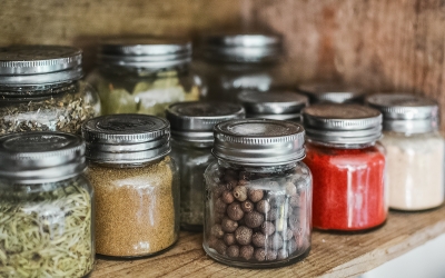 Jars full of carious dry foods and spices.